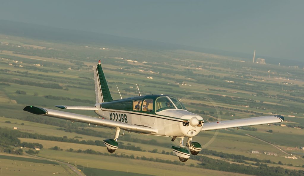Piper Cherokee 140 in flight