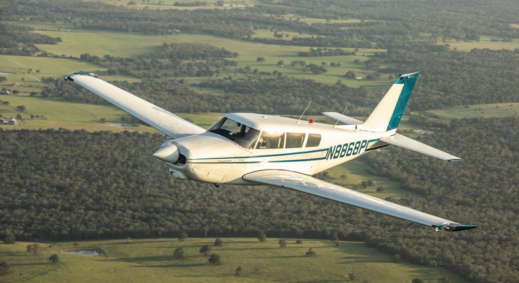 1966 Piper Comanche 260B in flight